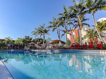 large pool with sundeck and lounge chairs