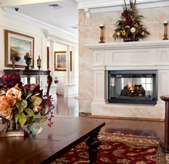 Fireside Seating at Spring Manor Senior Apartments in Poughkeepsie, NY