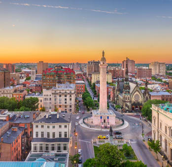 a cityscape of boston with a tall tower in the middle of the city