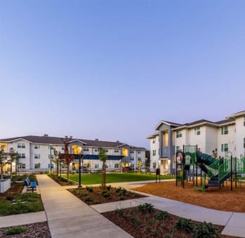 Playground & Green Spaces at The Retreat at Merced Affordable Apartments in Merced CA