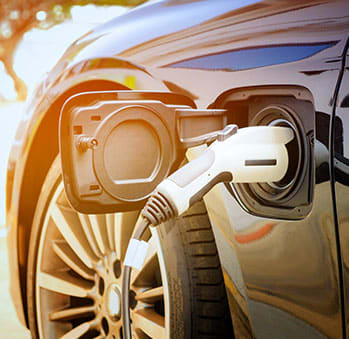a car is being charged at a gas stationat the perch, Los Angeles California