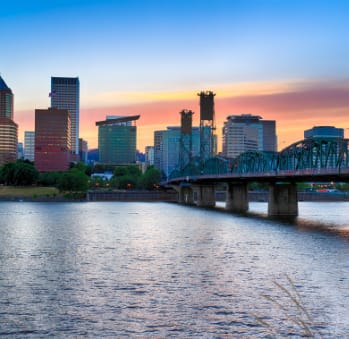 Portland skyline, river and bridge at sunset at TOWNSHIP Apartments, CANBY, Oregon
