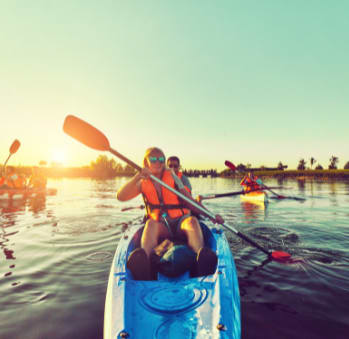Group of people kayaking at sunset at TOWNSHIP Apartments, CANBY