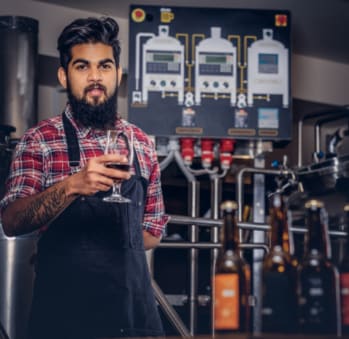 Man holding a glass of beer