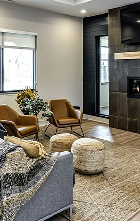 A living room with a fireplace and a tv at Tiburon Ridge, Omaha, NE 68136