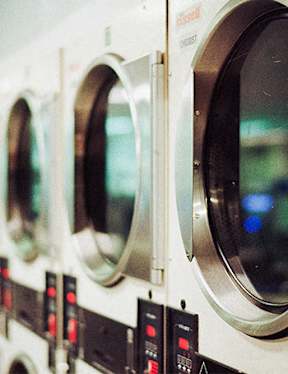 a row of washing machines sitting next to each other
