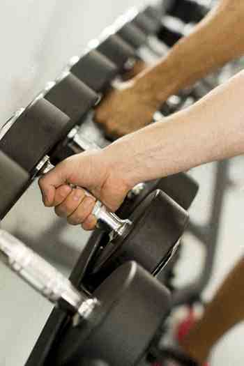 a person working out on an exercise bike in a gym