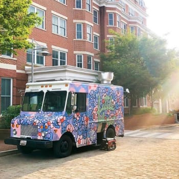 a food truck parked in front of a building