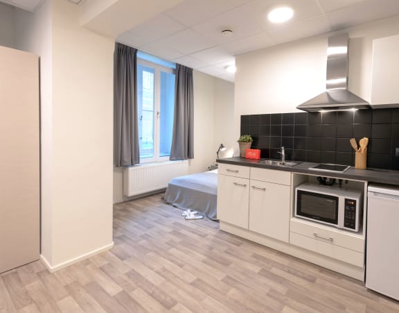 a kitchen with a stove and a sink