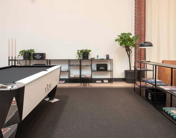 a game room with a pool table