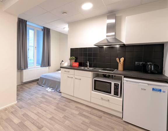 a kitchen with a stove and a sink