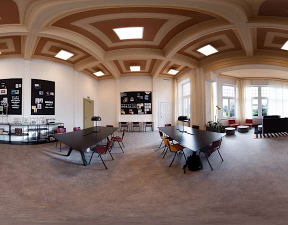 a dining room with tables and chairs in a large room with windows