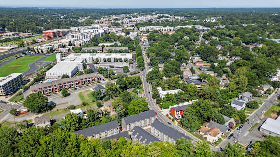 an aerial view of a city with buildings and trees at The Collection Charlotte in Charlotte, NC, 28205