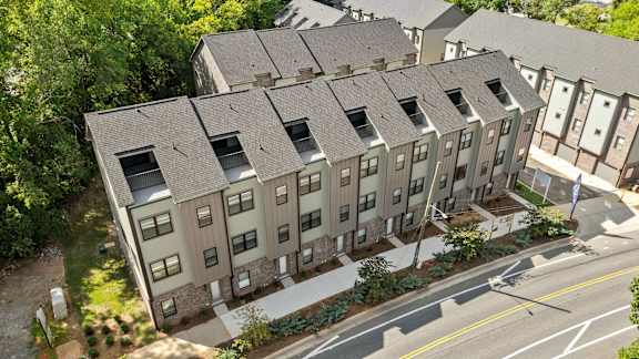 an aerial view of an apartment building on a city street at The Collection Charlotte in Charlotte, NC, 28205