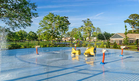 A water park with a slide and a pool.