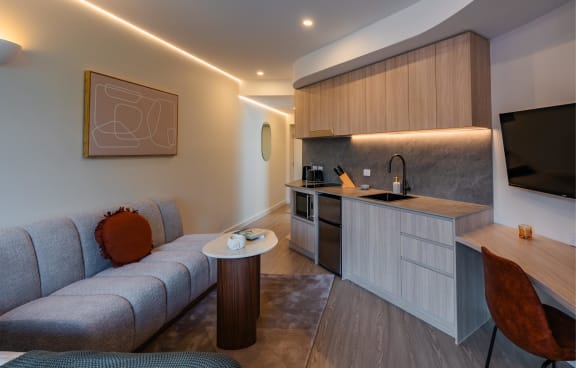 a living room and kitchen in a hotel room