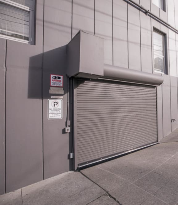 a closed garage door on the side of a building