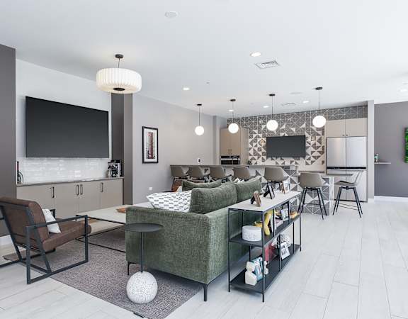 a living room filled with furniture and a large flat screen tv
