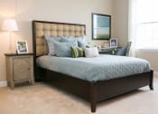 Thumbnail 12 of 23 - bedroom at VistaView apartments in Frederick, MD  with bed with blue linens, nighttable and desk at VistaView, Frederick, MD, 21702