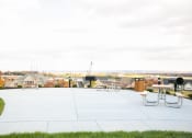 Thumbnail 3 of 23 - grilling area at VistaView apartments in Frederick, MD with picnic tables and grill area at VistaView, Frederick, 21702