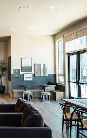 A modern living room with brown lounge chairs at Eastpark Apartment Homes, Salem, 97301