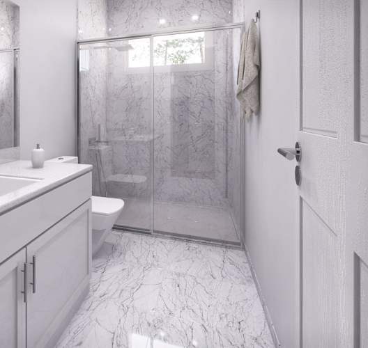 a white bathroom with a shower and a sink and a toilet