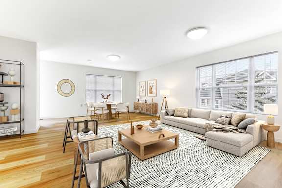 a living room with a couch and chairs and a rug  at Summit Wood Apartments, Watertown, 13601