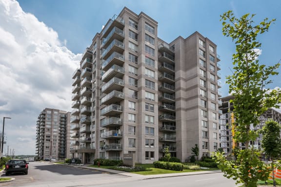 an apartment building on the corner of a street