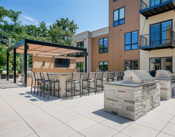 our apartments have an outdoor kitchen with a grill and pizza oven