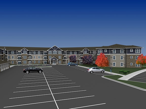 A car is parked in a parking lot in front of a building.