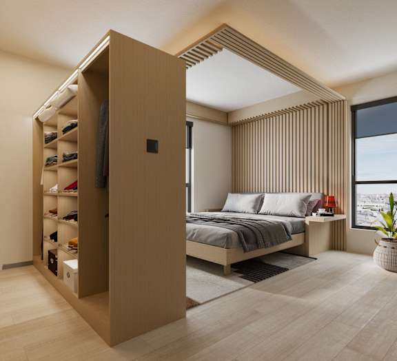 A modern bedroom with a large bed and a built-in wardrobe.