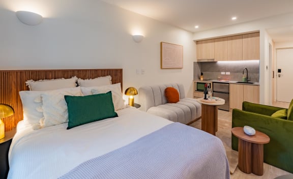 a hotel room with two beds and a kitchen
