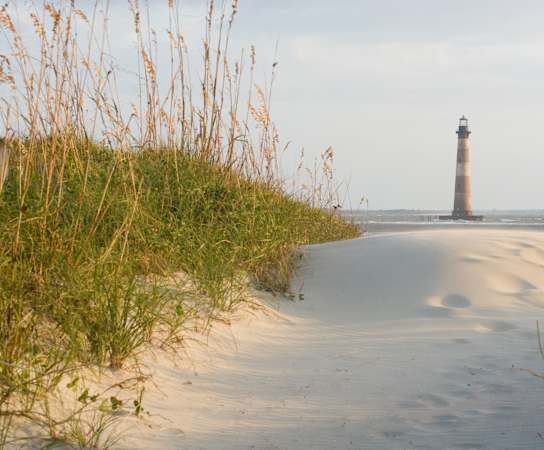 a view of the lighthouse from the beach at The Standard, Charleston, SC, 29412