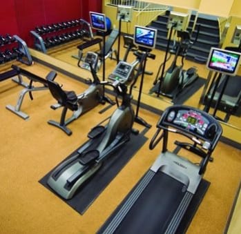 a room filled with lots of different types of exercise equipment at Myerton Apartments, VA