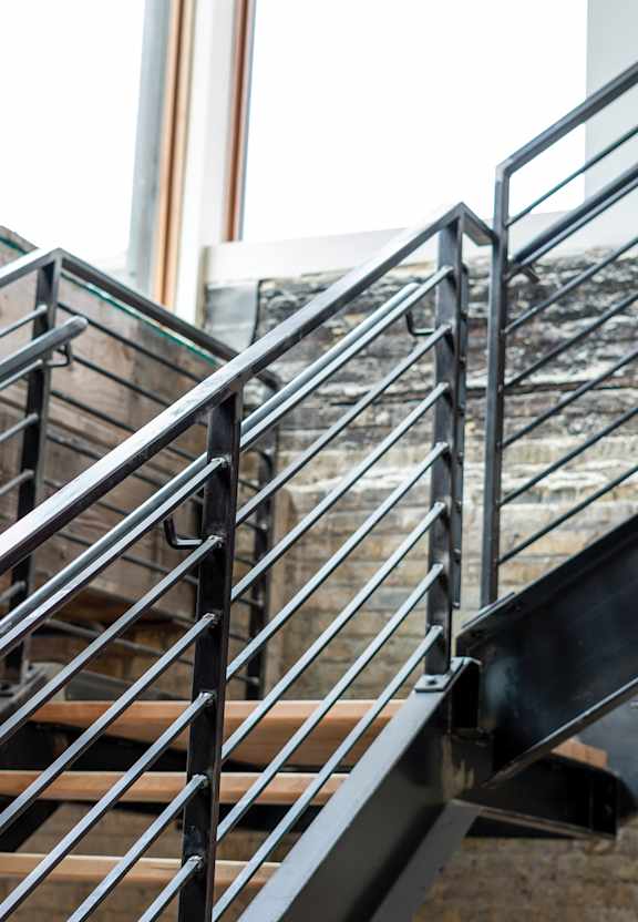 A metal staircase with wooden steps.