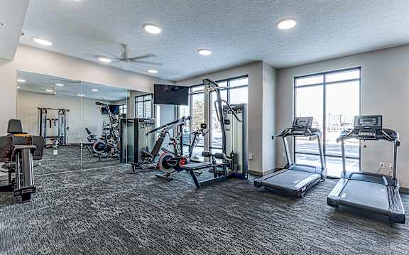 A spacious gym with treadmills, exercise bikes, and other equipment.at Tiffany Flats, Columbus, Ohio