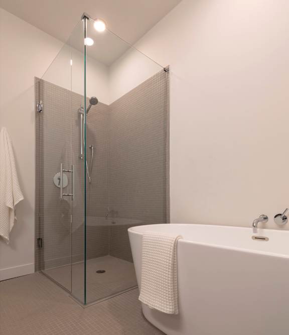 Glass separated shower and tub at Lofts at Centennial Yards, Georgia, 30303
