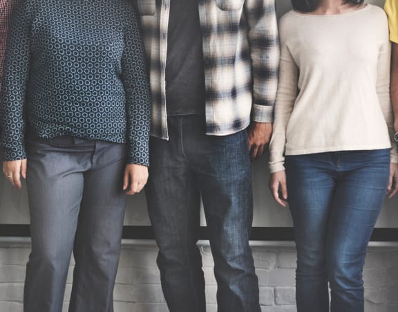 a group of people standing next to each other