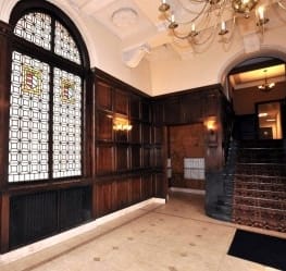 a bedroom with a bed and a door to a bathroom