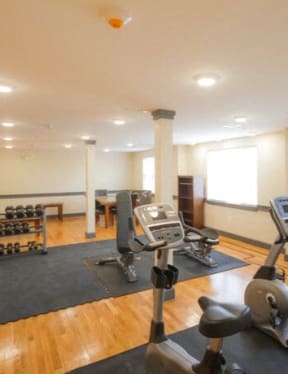 a room with a lot of exercise equipment in it