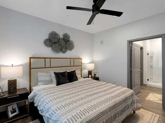 A bedroom with a large bed and a ceiling fan. at Drift, Daytona Beach, 32117