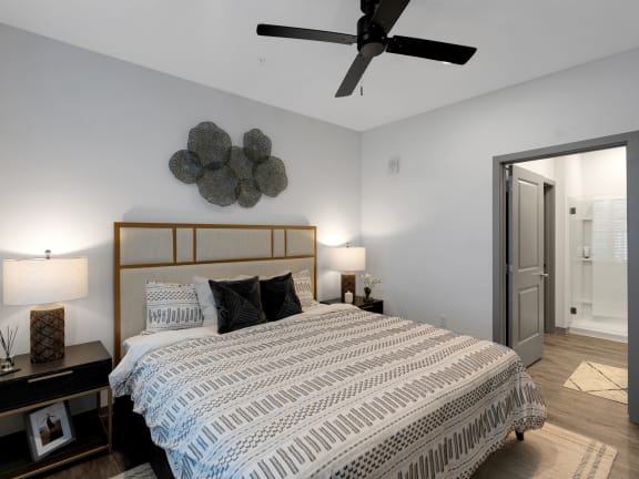a bedroom with a bed and a ceiling fan at Drift, Daytona Beach, FL, 32117