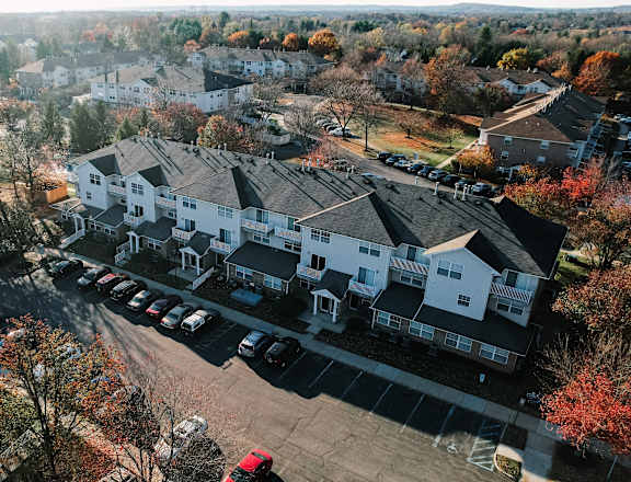a aerial view of a neighborhood with houses and cars