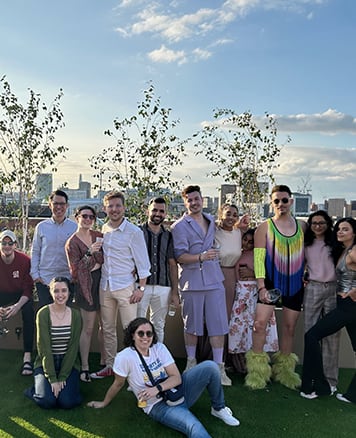 a group of people posing for a picture on a field