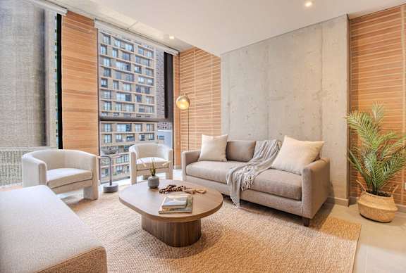 A living room with a couch, armchair, and coffee table.