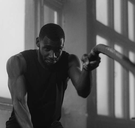 A man is working out in a gym.
