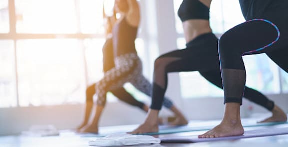 a group of people doing yoga in a yoga studio at 1700 California Street, San Francisco, 94109
