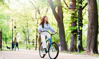 Woman on a bike in a park