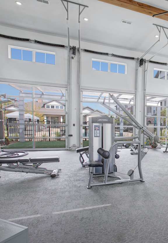 the gym at the enclave at woodbridge apartments in sugar land, tx
