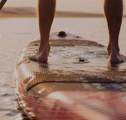 Man Standing on Stand Up Paddleboard